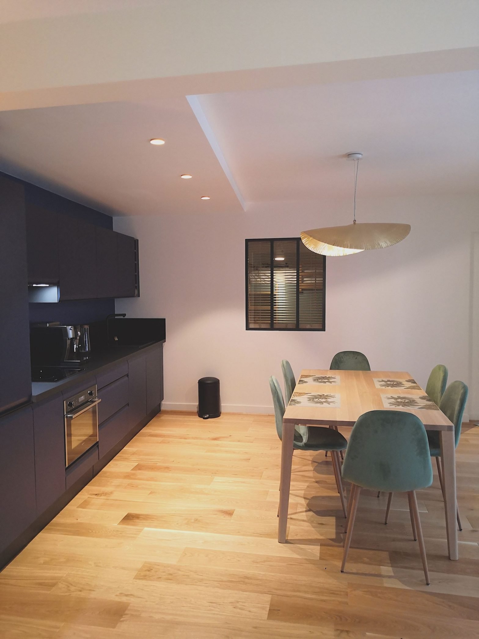a dining table and chairs in a room